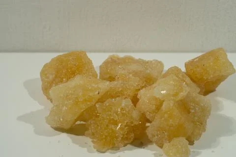 Rock sugar, in the form of irregular lumps and in smoother Stock Photos