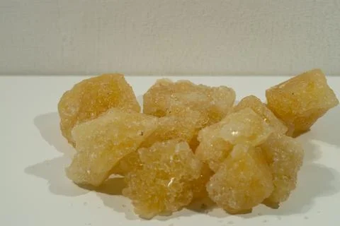 Rock sugar, in the form of irregular lumps and in smoother Stock Photos
