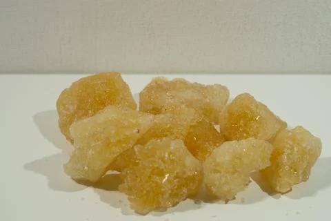 Rock sugar, in the form of irregular lumps and in smoother Stock Photos