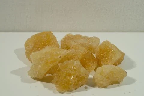 Rock sugar, in the form of irregular lumps and in smoother Stock Photos