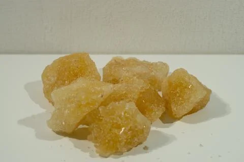 Rock sugar, in the form of irregular lumps and in smoother Stock Photos