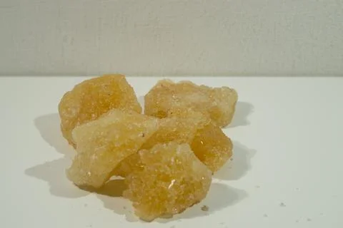 Rock sugar, in the form of irregular lumps and in smoother Stock Photos