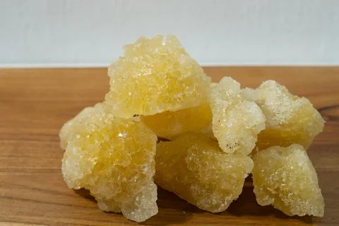 Rock sugar, in the form of irregular lumps and in smoother Stock Photos