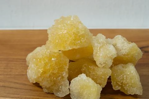 Rock sugar, in the form of irregular lumps and in smoother Stock Photos