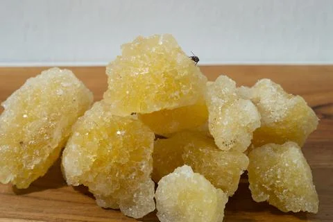 Rock sugar, in the form of irregular lumps and in smoother Stock Photos