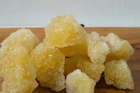 Rock sugar, in the form of irregular lumps and in smoother Stock Photos