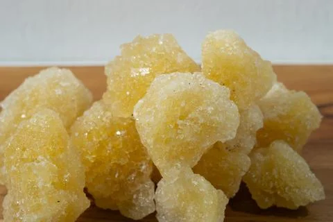 Rock sugar, in the form of irregular lumps and in smoother Stock Photos