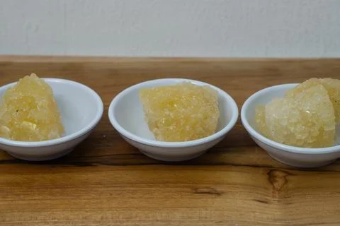 Rock sugar, in the form of irregular lumps and in smoother Stock Photos