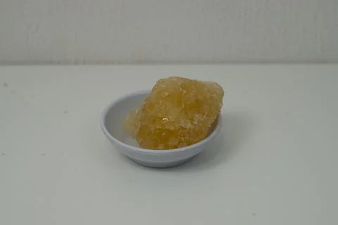 Rock sugar, in the form of irregular lumps and in smoother Stock Photos