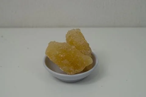 Rock sugar, in the form of irregular lumps and in smoother Stock Photos