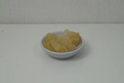 Rock sugar, in the form of irregular lumps and in smoother Stock Photos