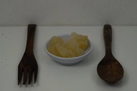 Rock sugar, in the form of irregular lumps and in smoother Stock Photos