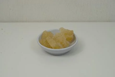 Rock sugar, in the form of irregular lumps and in smoother Stock Photos