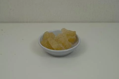 Rock sugar, in the form of irregular lumps and in smoother Stock Photos