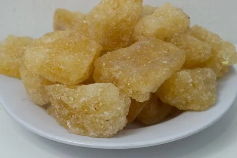 Rock sugar, in the form of irregular lumps and in smoother Stock Photos