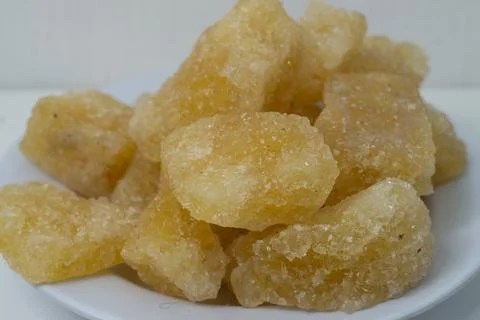 Rock sugar, in the form of irregular lumps and in smoother Stock Photos