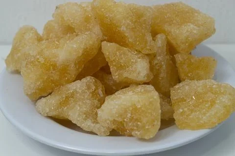Rock sugar, in the form of irregular lumps and in smoother Stock Photos