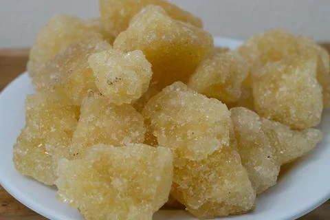 Rock sugar, in the form of irregular lumps and in smoother Stock Photos