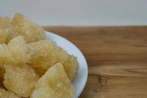 Rock sugar, in the form of irregular lumps and in smoother Stock Photos