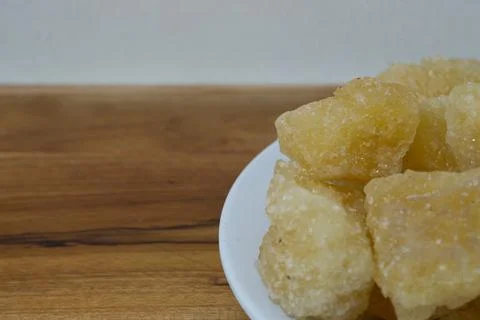 Rock sugar, in the form of irregular lumps and in smoother Stock Photos