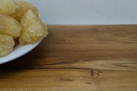 Rock sugar, in the form of irregular lumps and in smoother Stock Photos