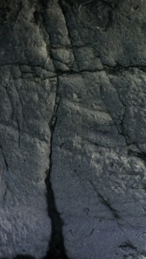 Rock surface with cracks and patterns in a natural environment Stock Footage 333565804