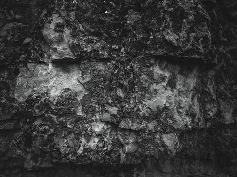 Rock surface with cracks. Black texture. Stone background. Dark marble. Rock  Stock Photos