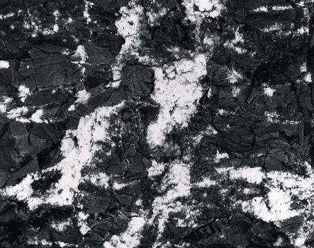 Rock surface with cracks. Black texture. Stone background. Dark marble. Rock  Stock Photos
