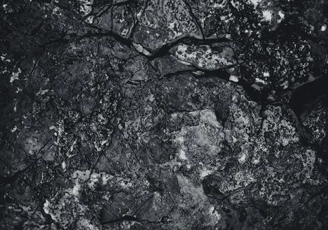 Rock surface with cracks. Black texture. Stone background. Dark marble. Rock  Stock Photos