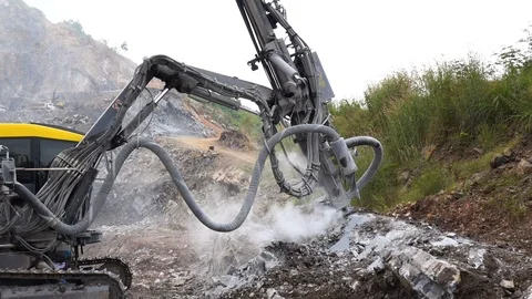 Rock surface drilling machine used to drill blast holes at quarry site Stock Footage 115482724