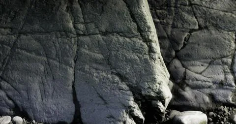 Rock surface with intricate texture and shadows under natural light Stock Illustration