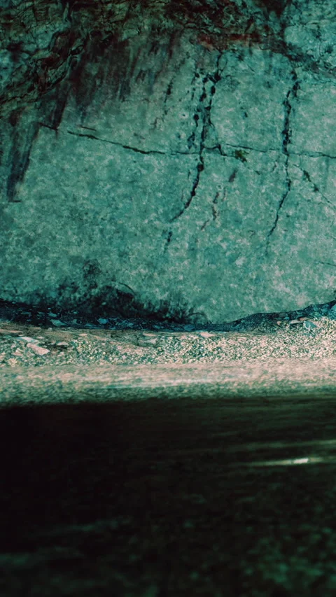 Rock surface shows texture and pattern in a natural setting during daylight Stock Footage 338351559