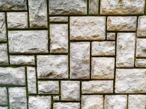 Rock texture background on a wall which have cuts on it. Stock Photos