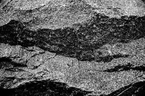 Rock texture. The surface of the stone is like a wall. White gray grunge Stock Photos
