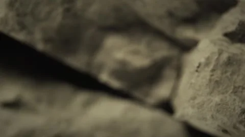 Rock texture video loop background, rotating and showing its rough surface Video stock 335598087