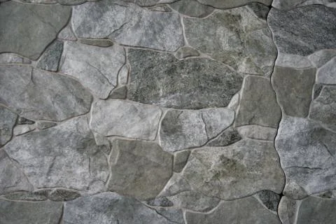 Rock texture wall background. Rock grey, green, white. Foto stock