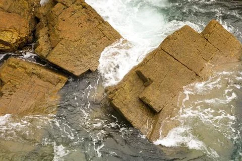 Rock textures and waves in a cliff in Galicia, Spain Stock Photos