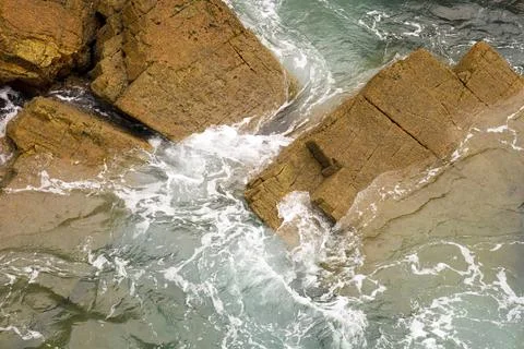 Rock textures and waves in a cliff in Galicia, Spain Stock Photos