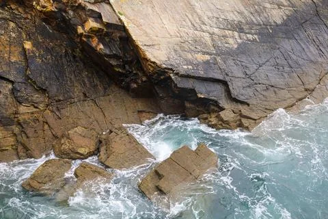 Rock textures and waves in a cliff in Galicia, Spain Stock Photos