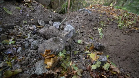 Rock thrown on the pile of rocks Stock Footage 158979471