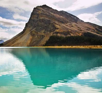 The rock of the triangular form The huge rock of the triangular form is re... Stock Photos