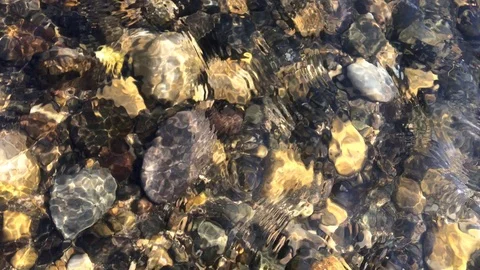Rock under river water wave Stock Footage 125802999