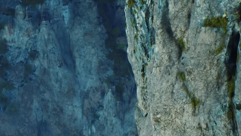 Rock wall in mountain area with texture and colors during daylight hours Stock Footage 340233485