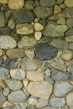 Rock wall pattern river stone facture design Stock Photos