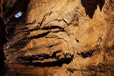 Rock wall shaped into horizontal terraces by ancient underground water flow.. Stock Photos