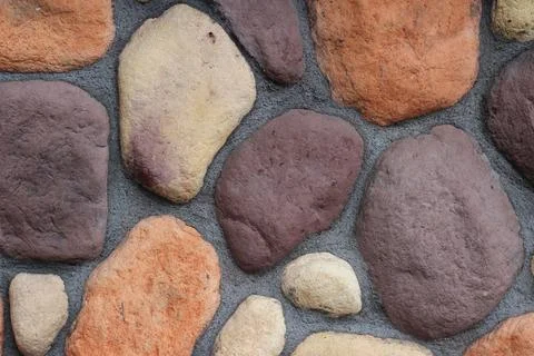 Rock wall texture background image. Urban decorative exterior photo. Stock Photos