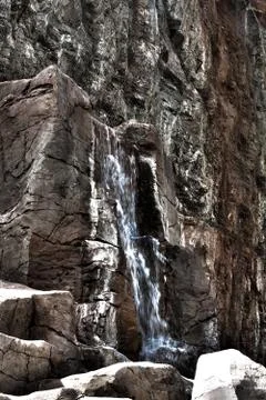 Rock wall with waterfall Stock Photos