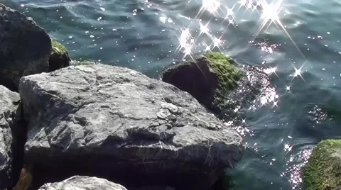 Rock water sun motion Stock Footage 6530009