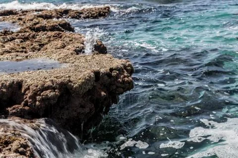 Rock in Waves Stock Photos