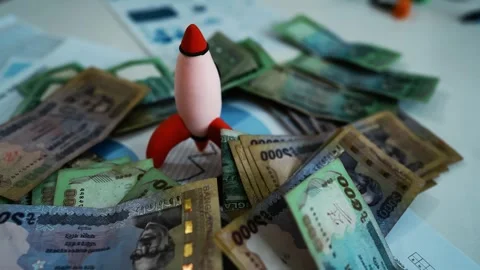 Rocket with Bangladeshi Currency Notes, A rocket surrounded by various deno.. Stockbeeldmateriaal 304961306